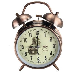 Antikolt bronz ébresztőóra dupla csengővel és figurás számlappal 16.5 cm Metroman